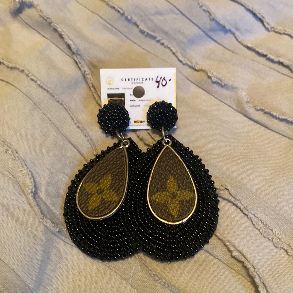 Repurposed L*V* black beaded earring. Still has tags and certificate.